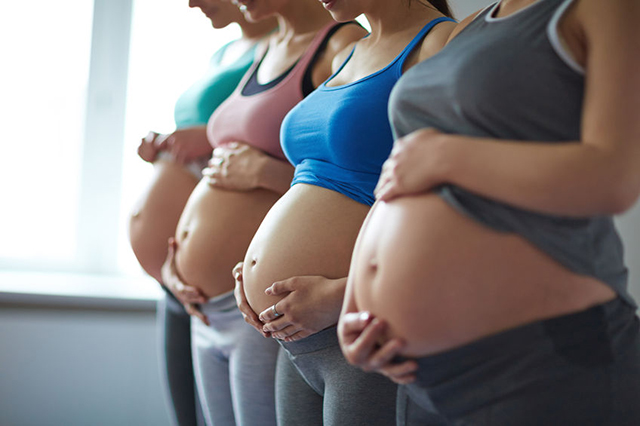 Pregnant women standing in line