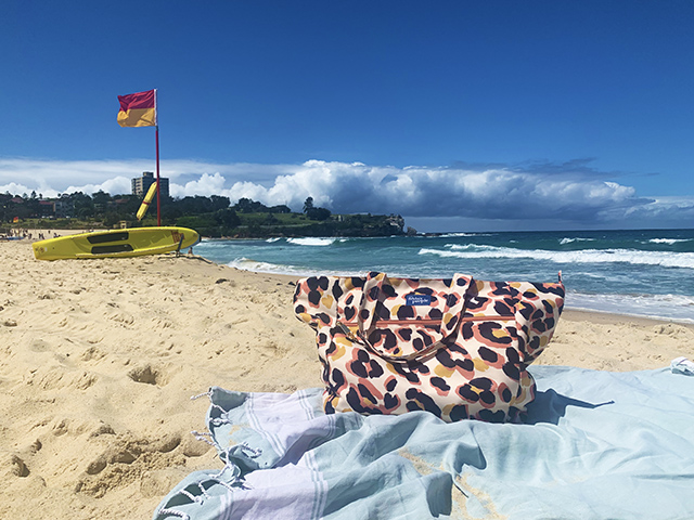 The Friday People tote bag on Coogee beach