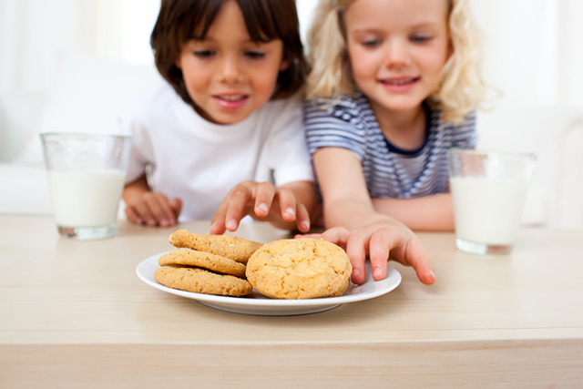 Kids eating biscuits